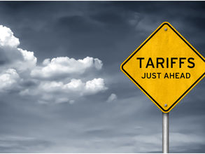 traffic sign with the words Tariffs Just Ahead on it