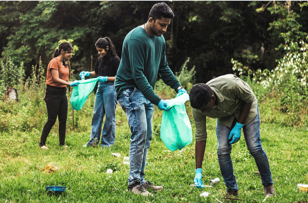 young people picking up trash at a park