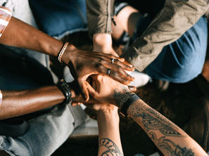 hands all coming together as a team