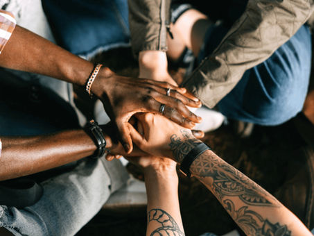 hands all coming together as a team