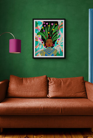 Beautiful vibrant artwork of peaceful African American Black woman. The woman has  her hair up. There are flowers and leaves in her hair. The artwork is on a green wall in a living room