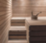 Wooden sauna interior with tiered benches and a wooden bucket with a ladle