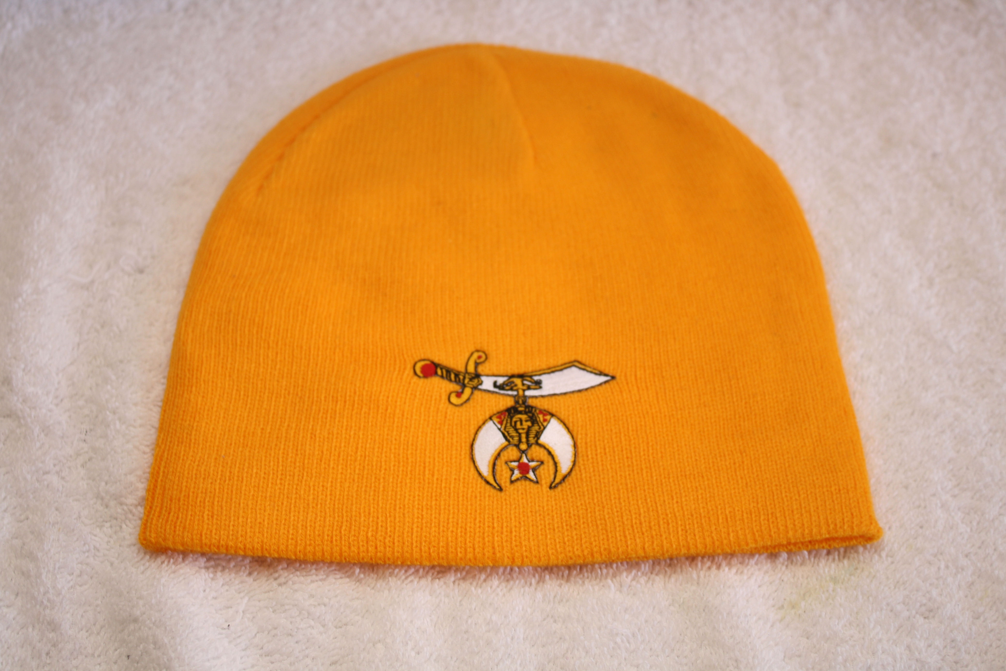 Shriner knit hat with scimitar logo emblem