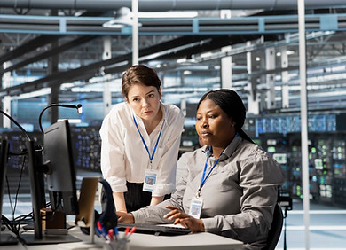 team-admins-working-together-server-hub-analyzing-rigs-data.jpg