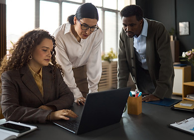 multiethnic-young-adult-business-team-collaborating-around-laptop-office.jpg