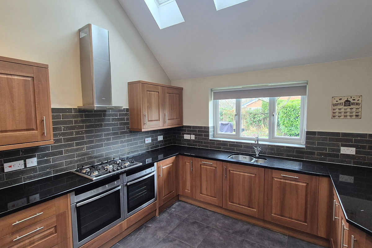 Wide shot of completed kitchen wall tiling in Warrington