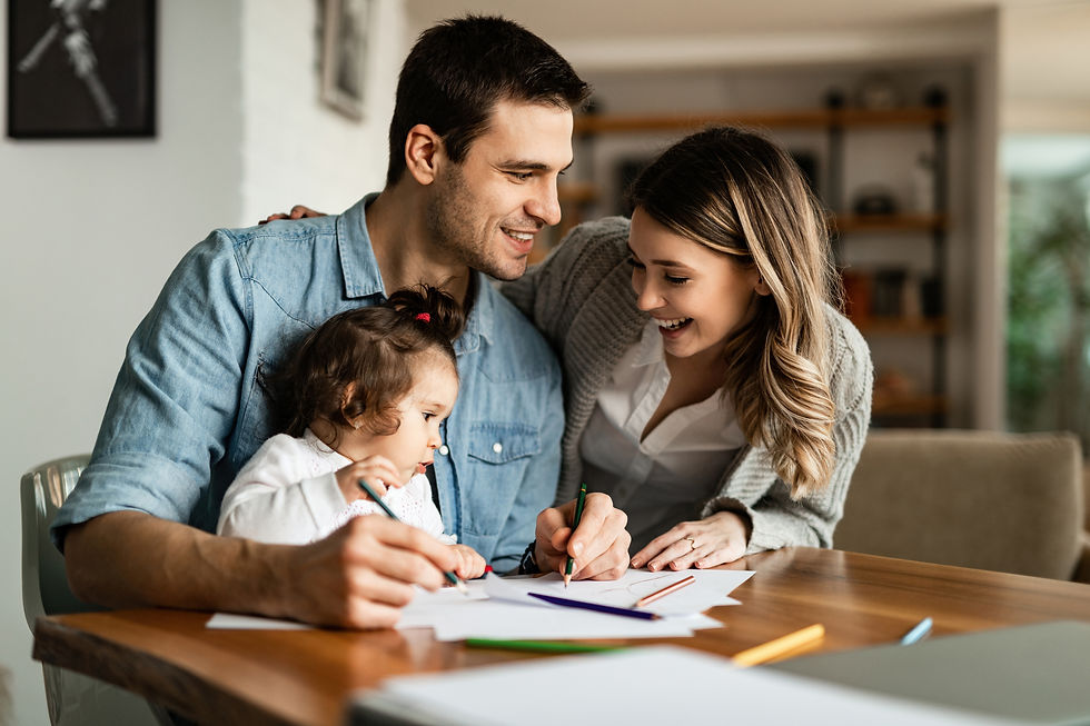 young-happy-parents-enjoying-coloring-with-their-small-daughter-home.jpg