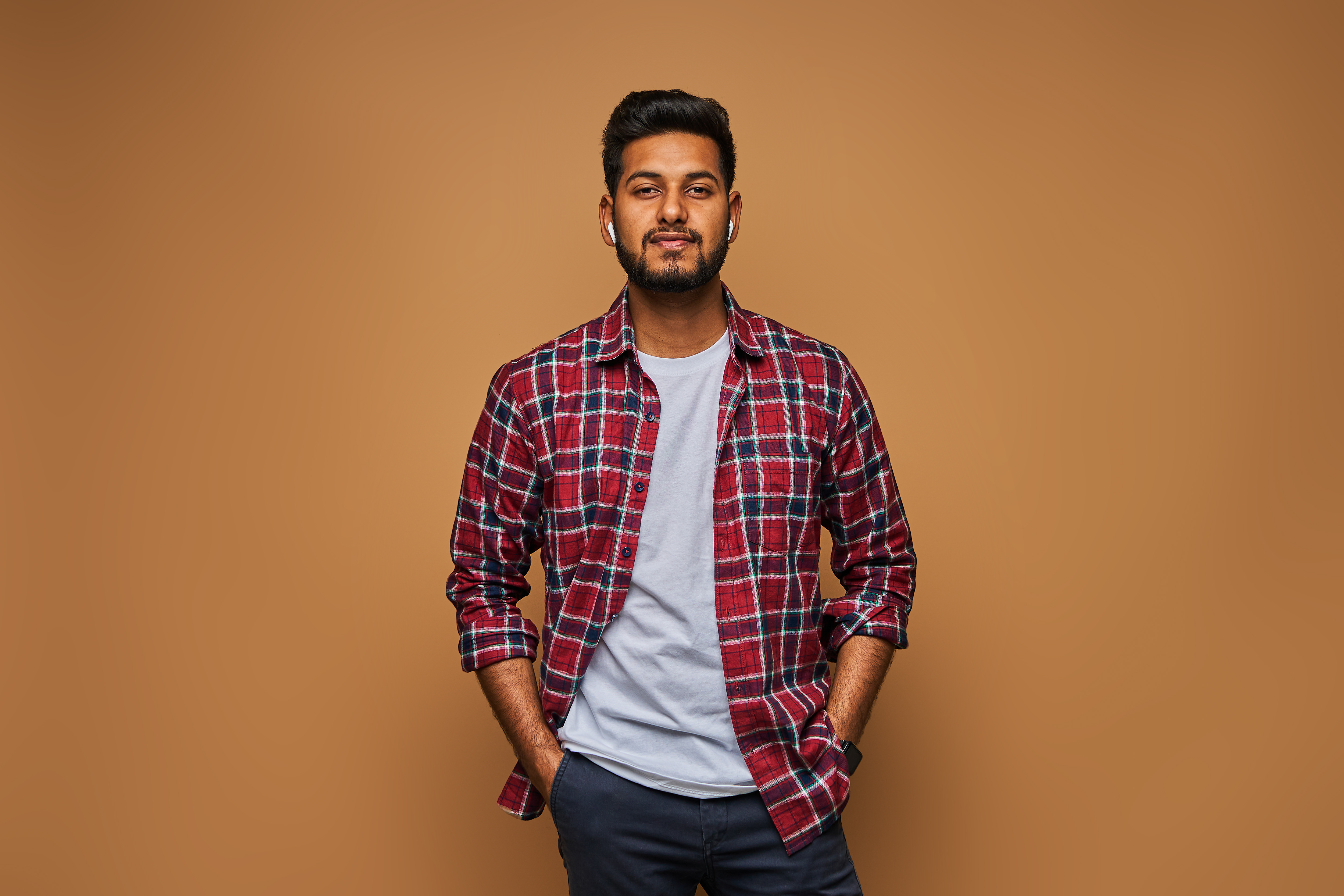 stylish-handsome-indian-man-tshirt-pastel-wall.jpg