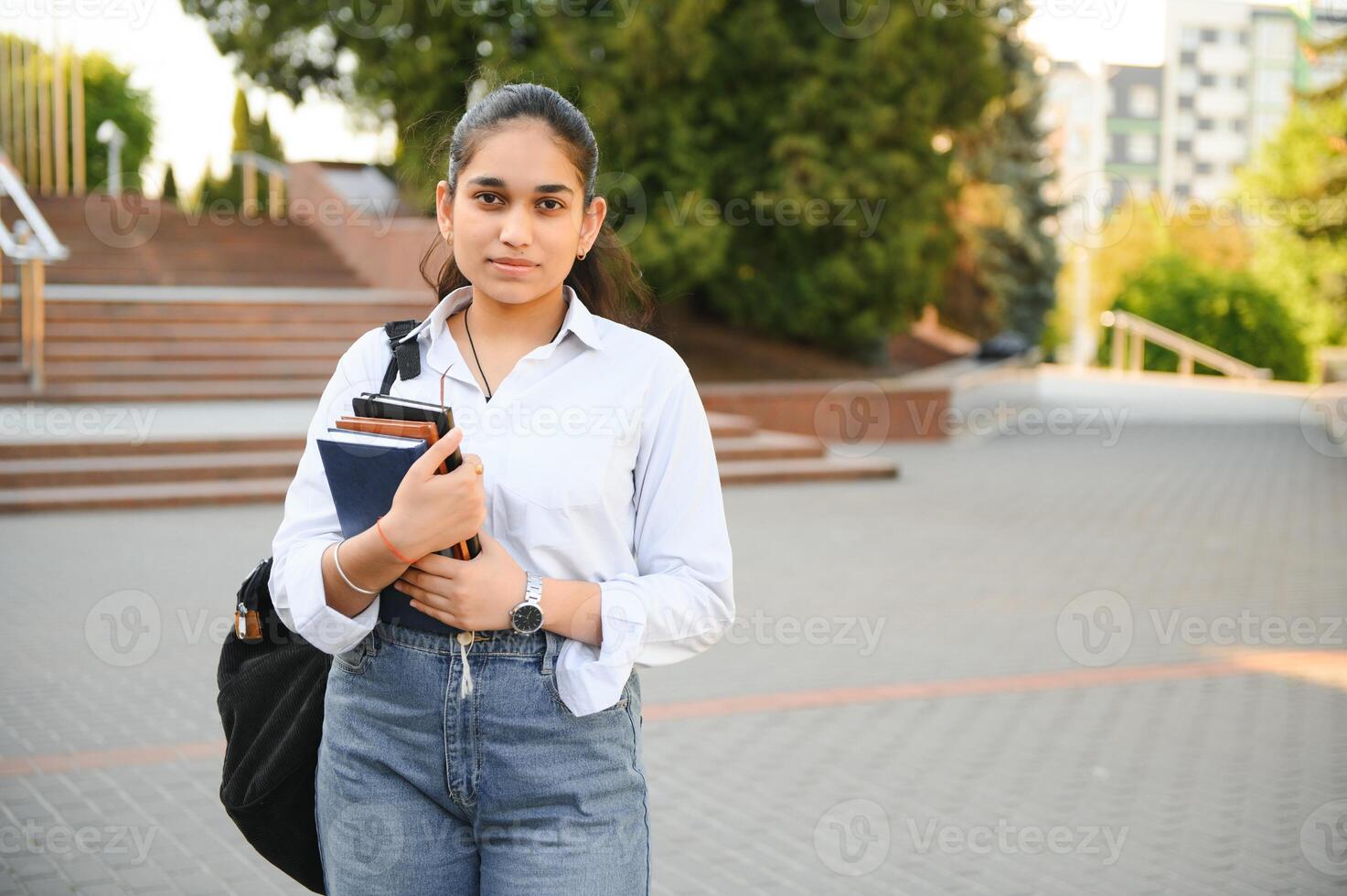 portrait-of-indian-girl-student-with-books-near-university-photo.jpg