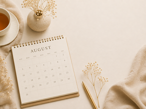 tablescape with a calendar, cup of tea, pen, a blanket and dried flowers