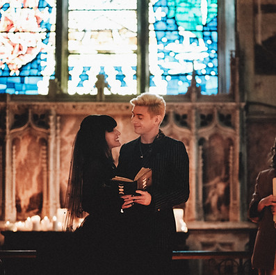 A beautifully gothic punk ceremony in Bristol. The couple gaze lovingly at each other as they read their wedding vows during the celebrant led ceremony.