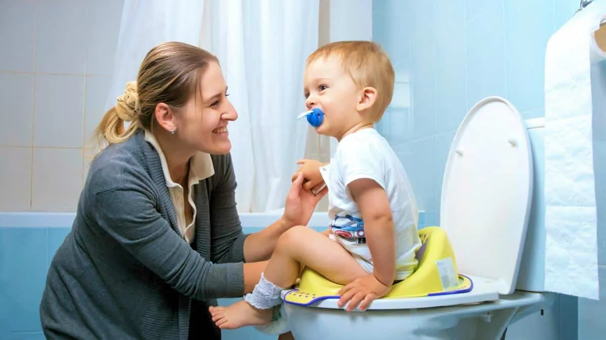 young-mother-smiling-after-her-toddler-Potty-ss.webp