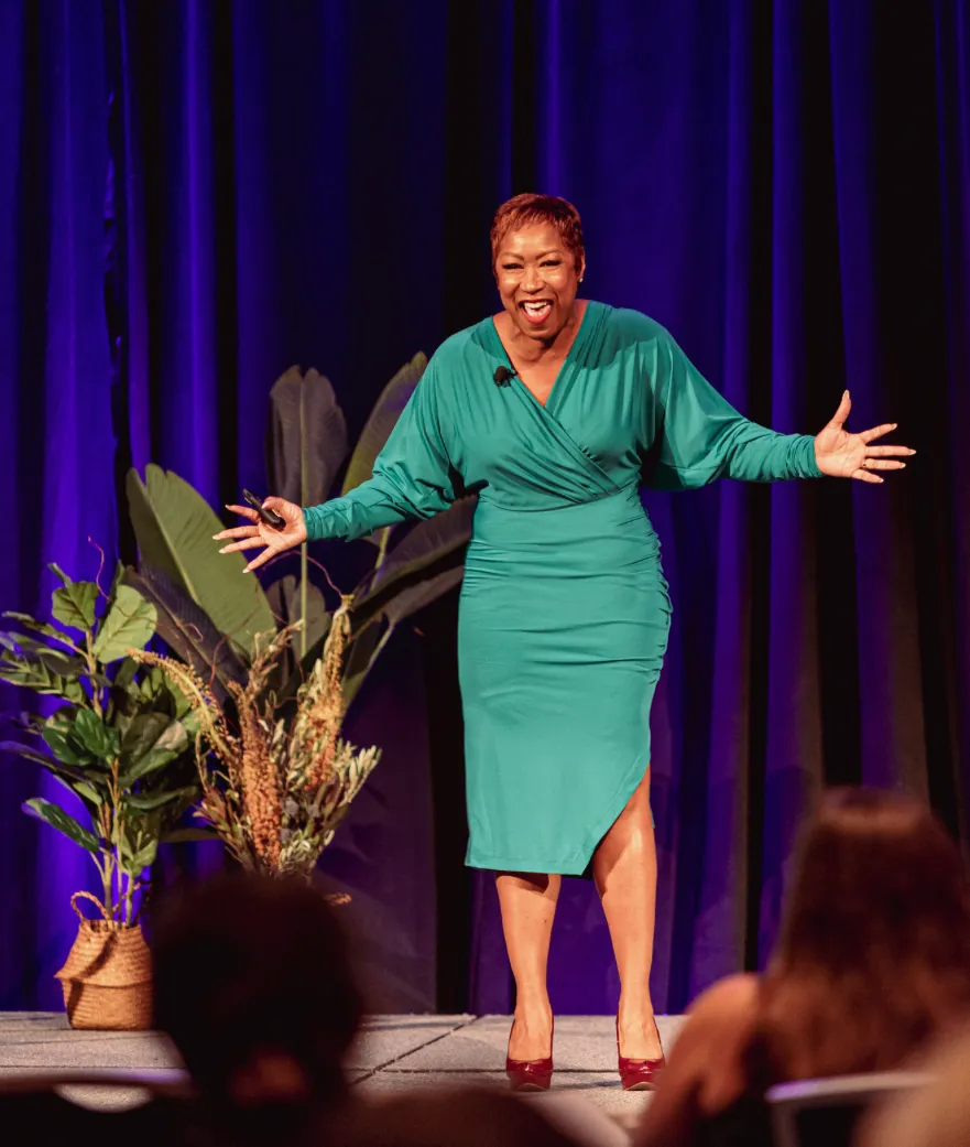 Deya Speaking to women.webp