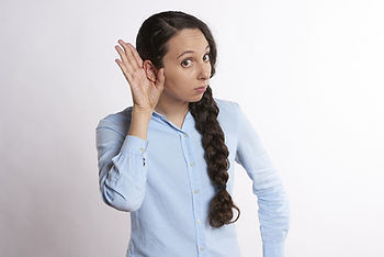 Woman cupping ear to listen