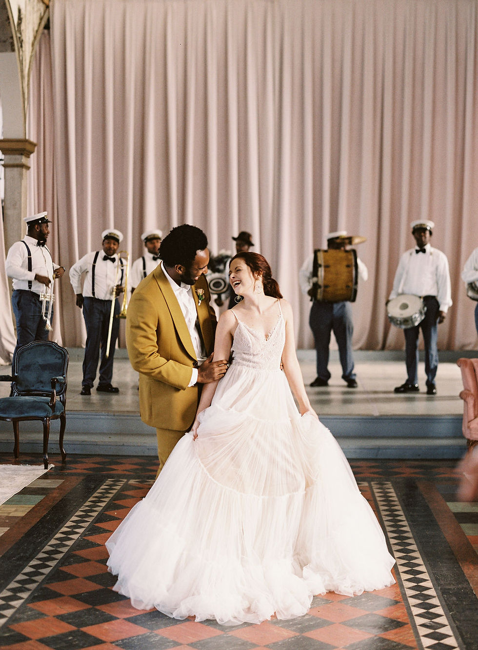 Bride and Groom with Kinfolk Brass Band for Bridgerton Inspired Wedding at the Marigny Opera House in New Orleans with Lounge Spaces and Vintage Furniture by Lovegood Rentals