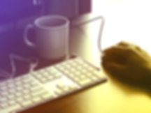 Man's hand at computer with coffee mug