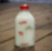 Farmers' Creamery Whole Milk, shown here in a half gallon bottle.