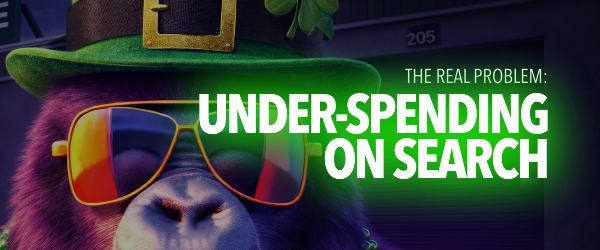 Bear wearing green hat and sunglasses, with text "The Real Problem: Under-Spending on Search" in bright green. Background features a dark building.
