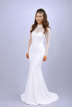 Elegant white mini bridal dress with illusion long sleeves, sweetheart neckline, sparkling bead embroidery, fitted satin skirt, and soft side drape details displayed on a mannequin against a clean white background.