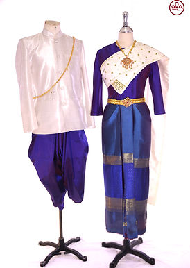 Pinder SW2425 – navy-blue women’s silk shirt suit with white sabai woven in golden threads, decorated with green emerald bug motifs, paired with free-size pha tung skirt; Lamphun silk, men’s matching outfit in all sizes.