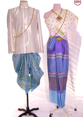 Thai traditional couple outfit in blue, white, and sky blue with gold embroidery – men’s white jacket and women’s silk draped shoulder cloth – Pinder Atelier costume rental.
