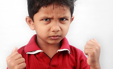 Portrait of Indian kid with ready to fig