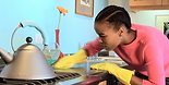 young-african-american-woman-cleaning-countertop-in-kitchen-stock-png-black-woman-cleaning