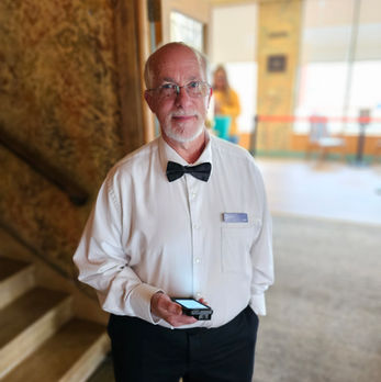 Volunteer welcomes guests at Marion Palace