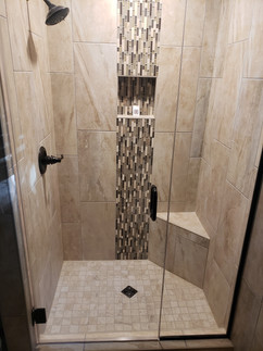 Tile Shower with Bench and Glass Decorative Strip.jpeg