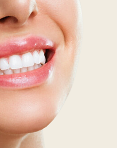 Close up of a woman smiling away from the camera