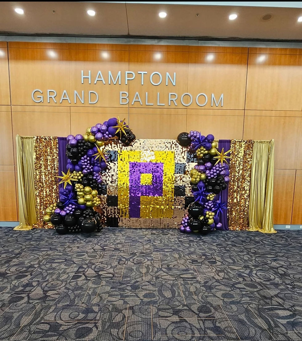 Purple and black balloon decor at Hampton Grand Ballroom.