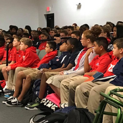 Massey Campos speaking to a group of students at Nation Academy
