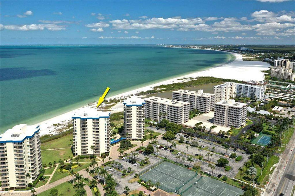 Aerial view of beachfront condos and coastline on Fort Myers Beach, Florida