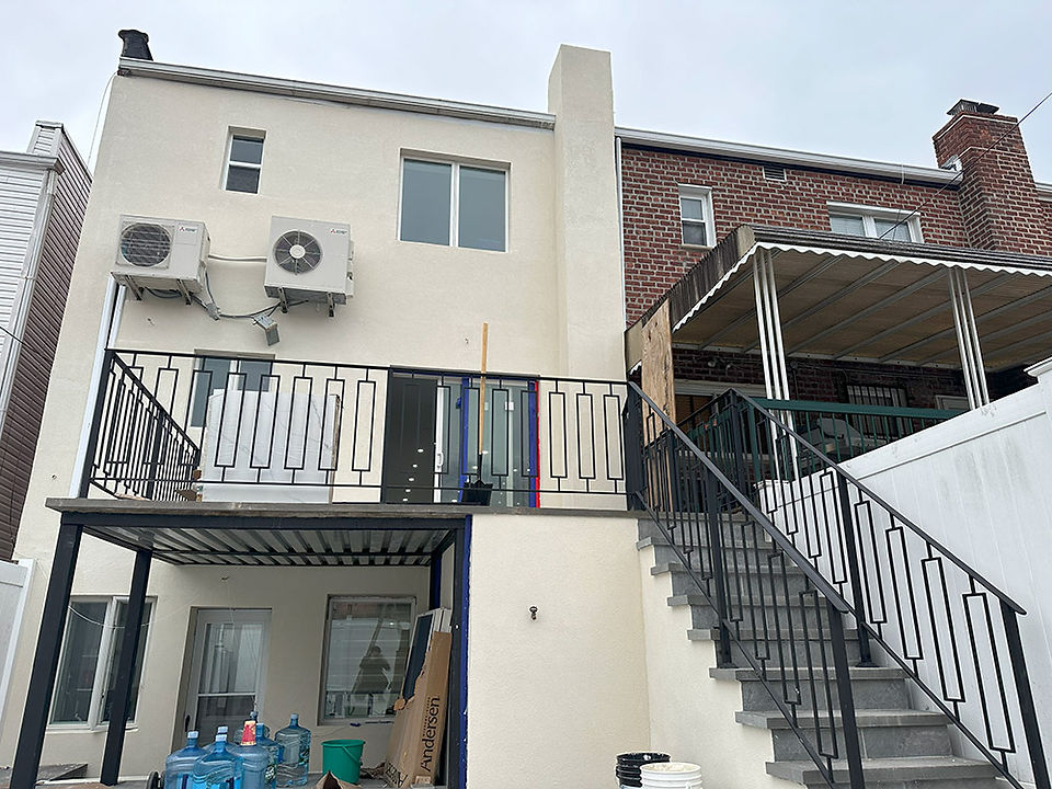 iron railings and brick stairs at home windows and under construction