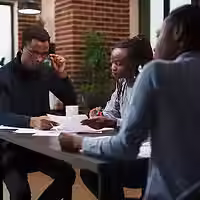 african-american-research-agency-coworkers-meeting-about-startup-project-financial-status-