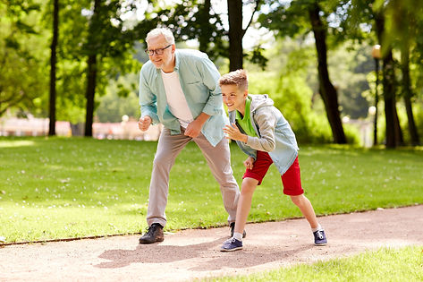 grandfather playing with grandson showing no pain