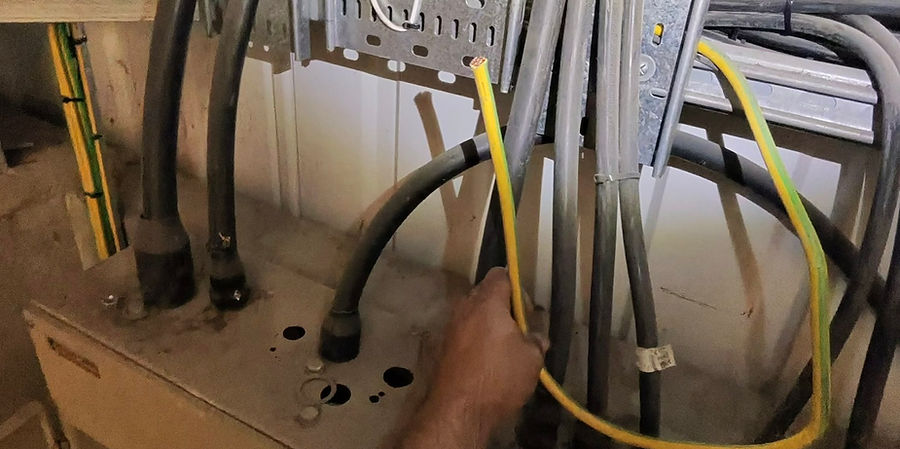 Cut main protective bonding conductors creating a potentially dangerous electrical safety defect, identified during an EICR inspection.