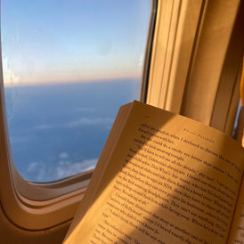 Reading on the airplane, aesthetic, sunset