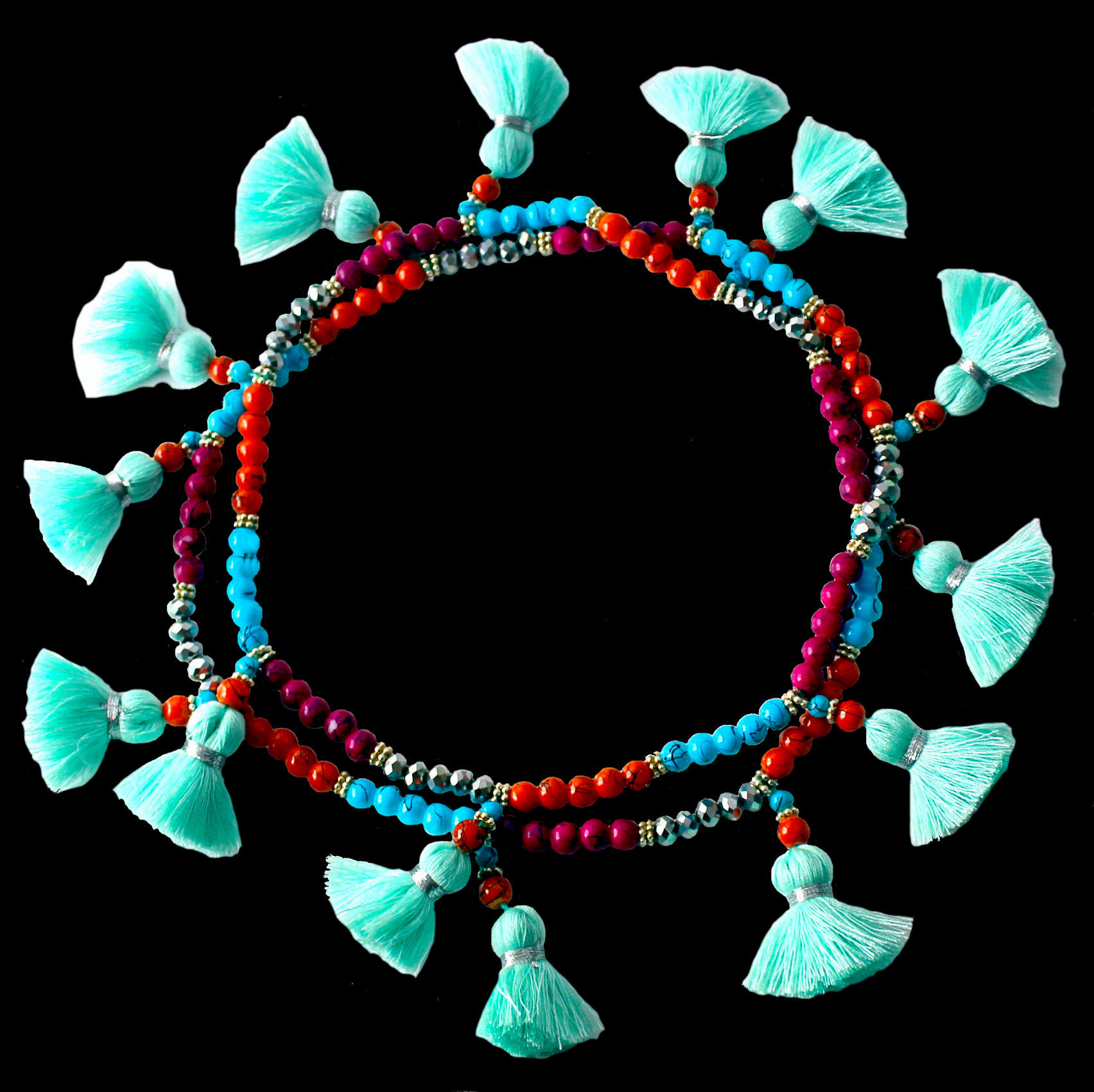 Long necklace with colourful and silver-coloured glass beads and turquoise tassels