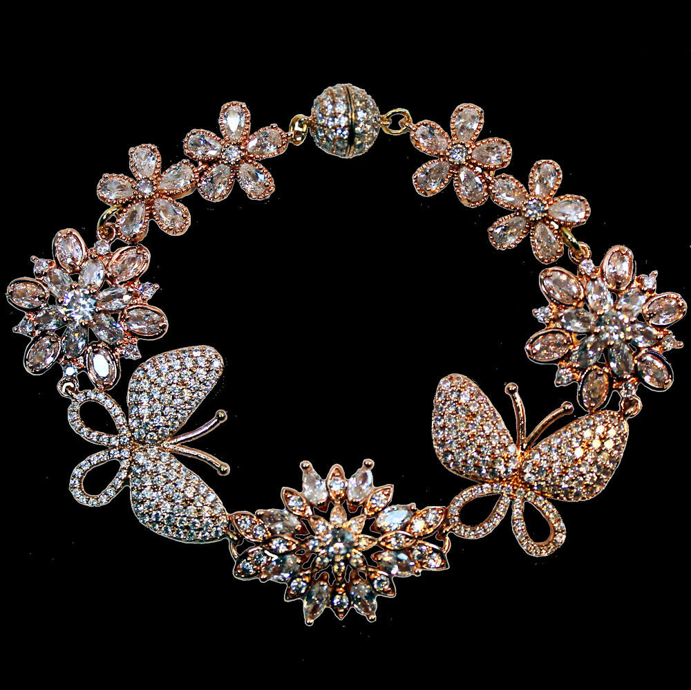 Bracelet with butterflies, flowers and zirconia in rose gold-plated copper