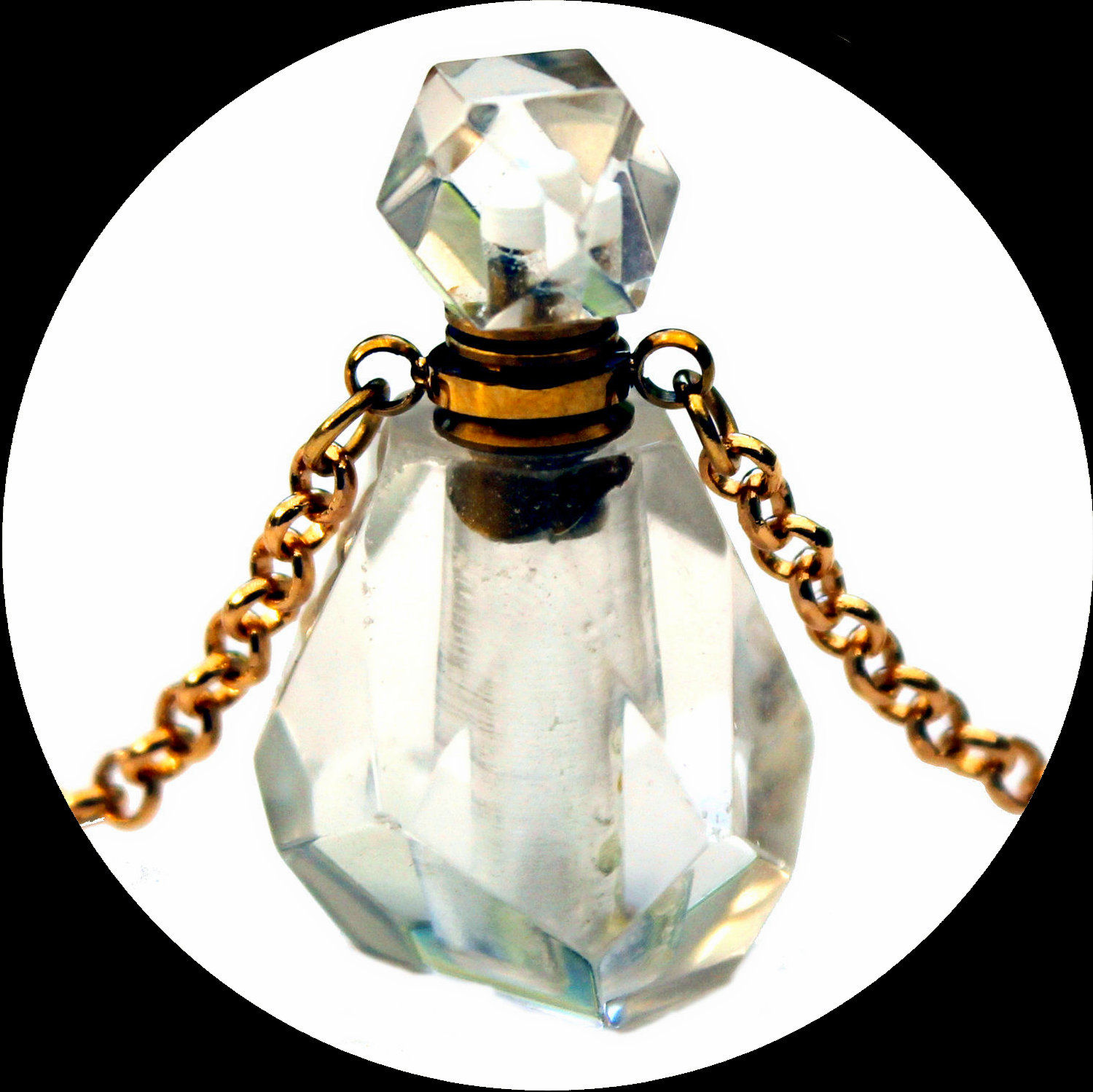 Faceted rock crystal perfume bottle on a long gold-plated copper chain