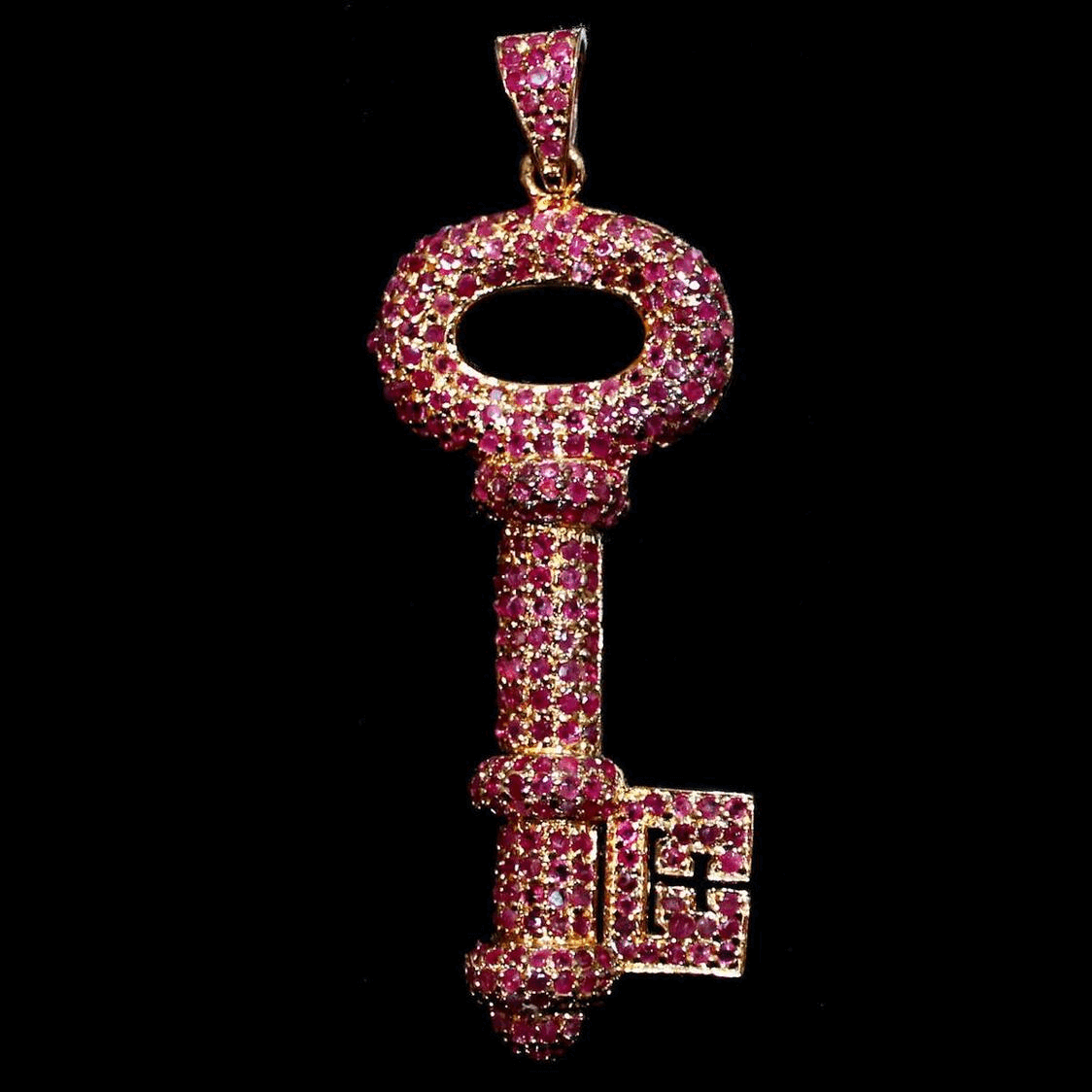 Key-shaped pendant with rubies in gold-plated 925 Sterling silver