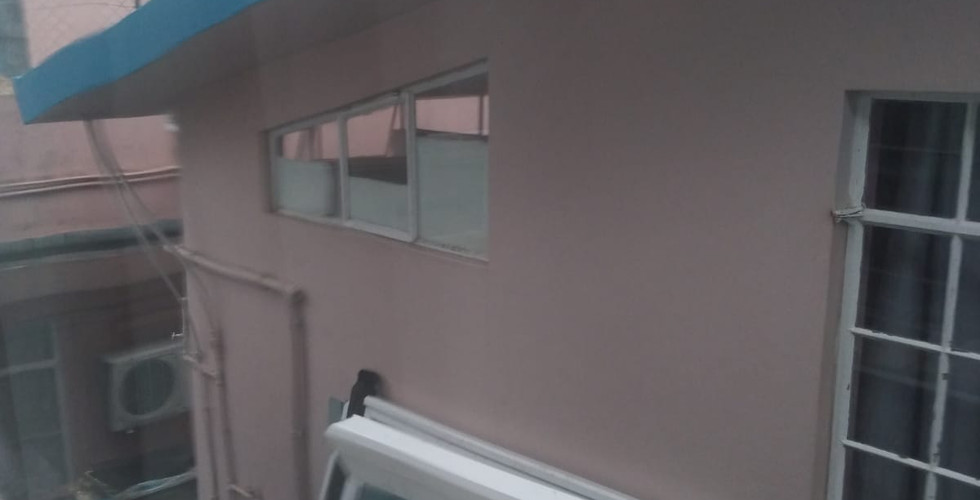 Damaged aluminum frame with broken glass panes