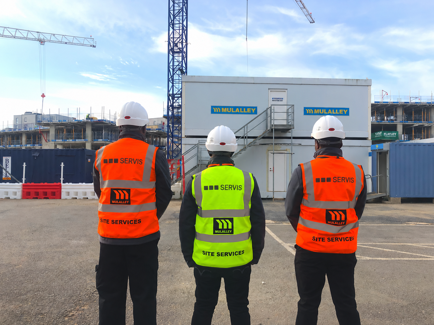 Servis colleagues in high-visibility clothing at a construction site