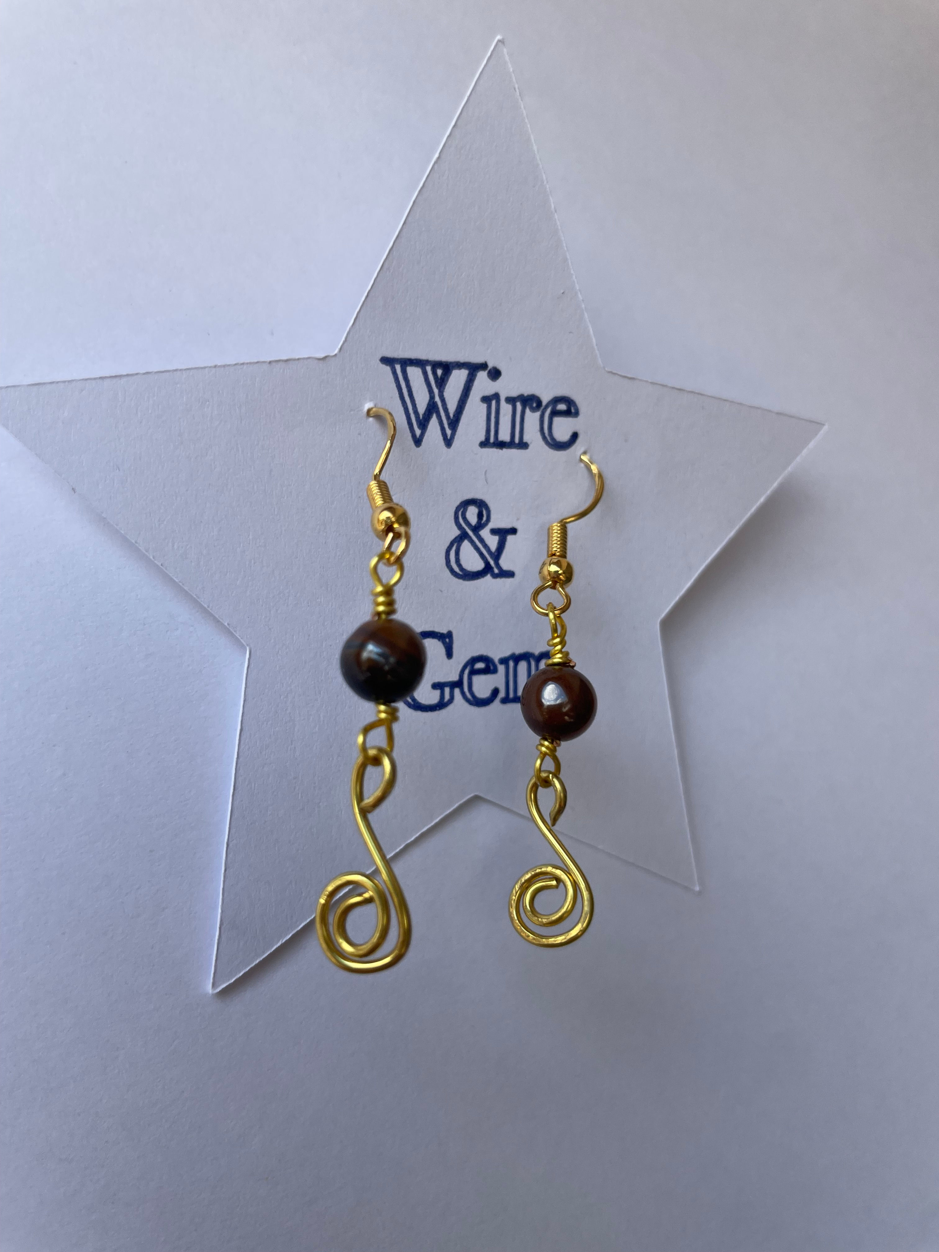 gold spiral drop earrings with tigers eye