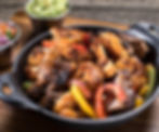 CHICKEN, STEAK AND SHRIMP FAJITAS