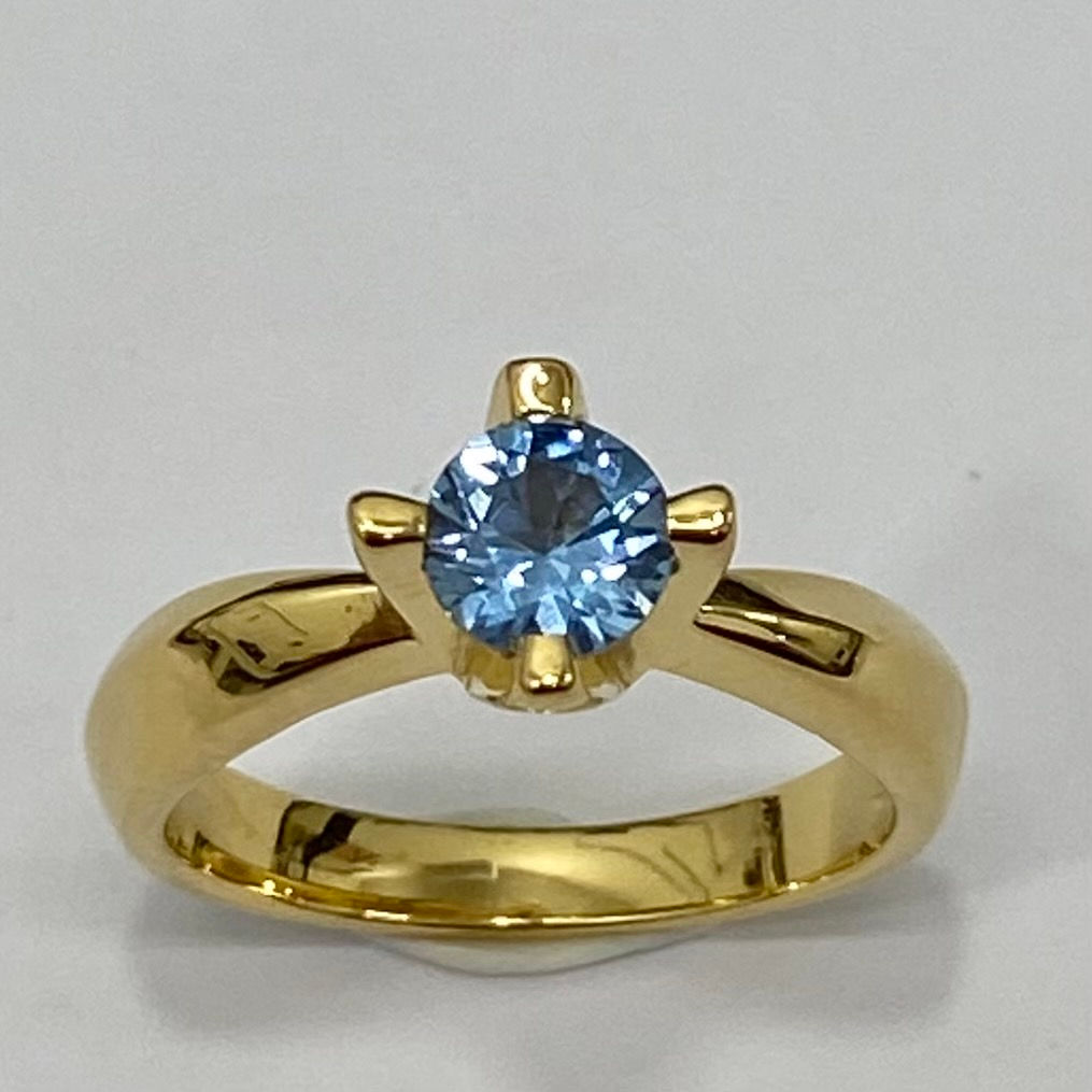 Solitario con circonita "aguamarina" de plata de 1ª ley chapada en oro.