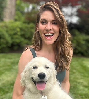 golden retriever puppy with her trainer learning to be a well behaved dog