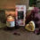 Thumbnail: Warmly lit candle with heart shaped soap and chocolate bar