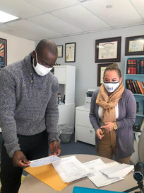 attorney morales giving client check.jpe